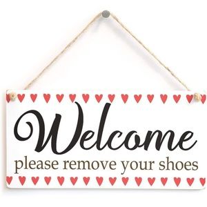 Welcome remove shoes sign.